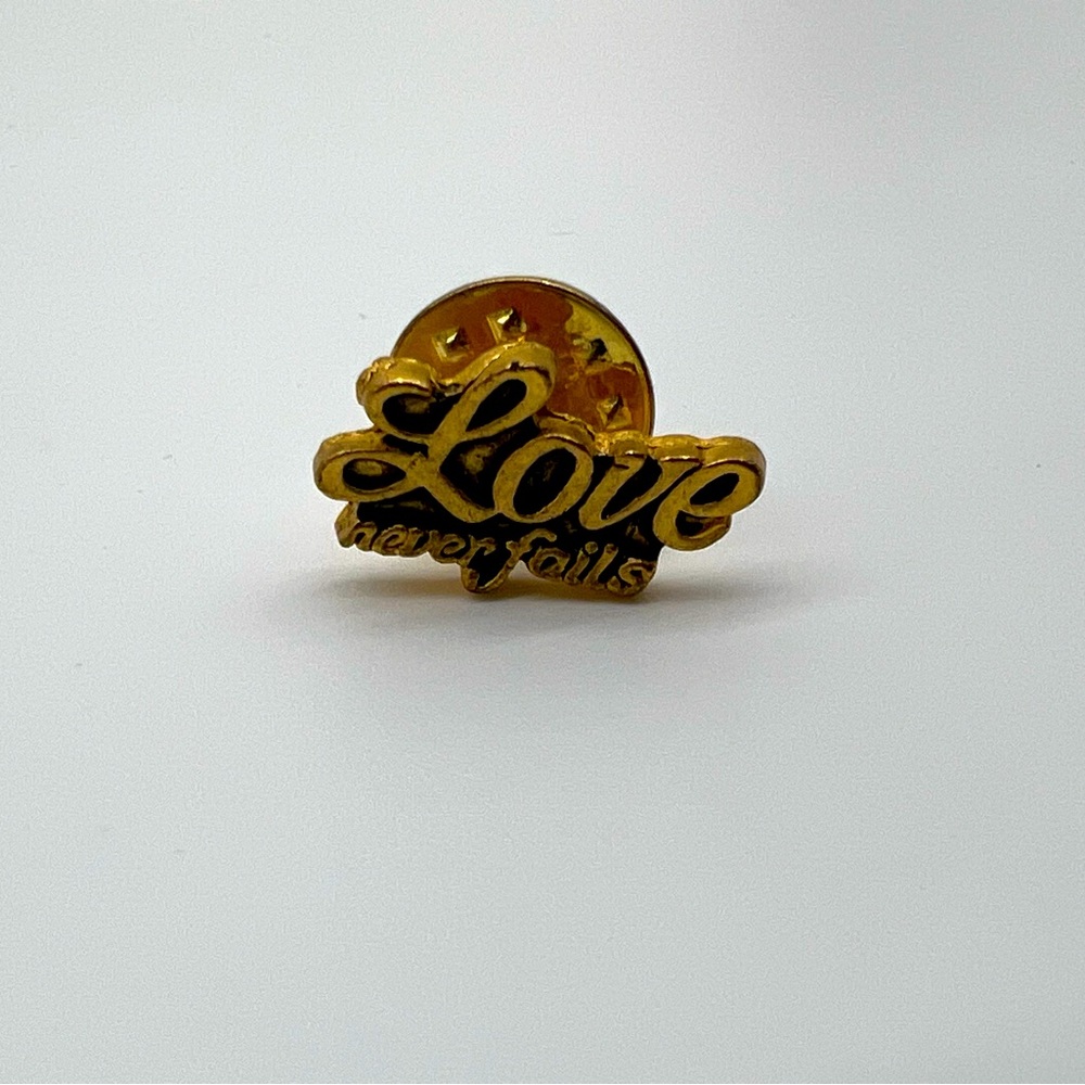 Love Never Fails Pin